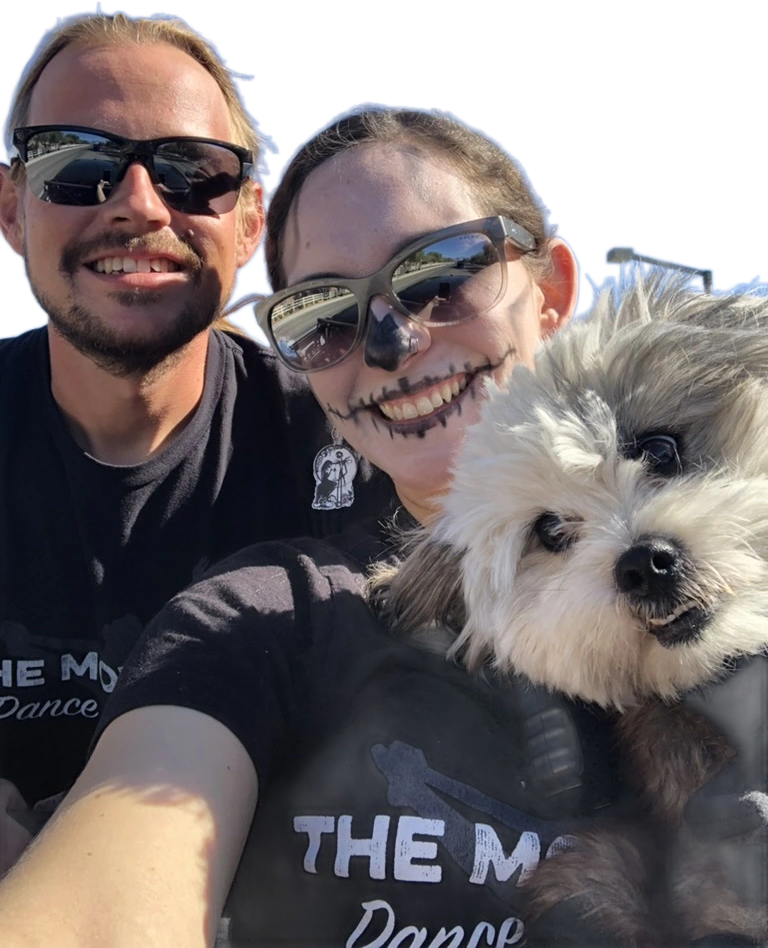 Seth and Mandy in Halloween face paint with their dog