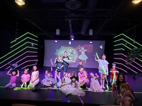 Kids celebrating a birthday party on the Ovation Theatre stage at The Movement in Las Vegas