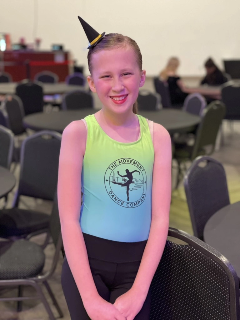 A Movement Dance Company dancer smiling in her company leotard