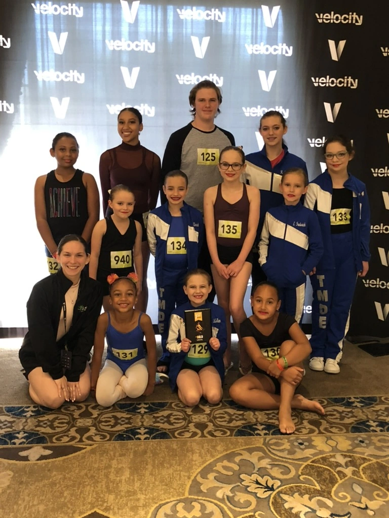 The early Movement Dance Company team in matching jackets at Velocity