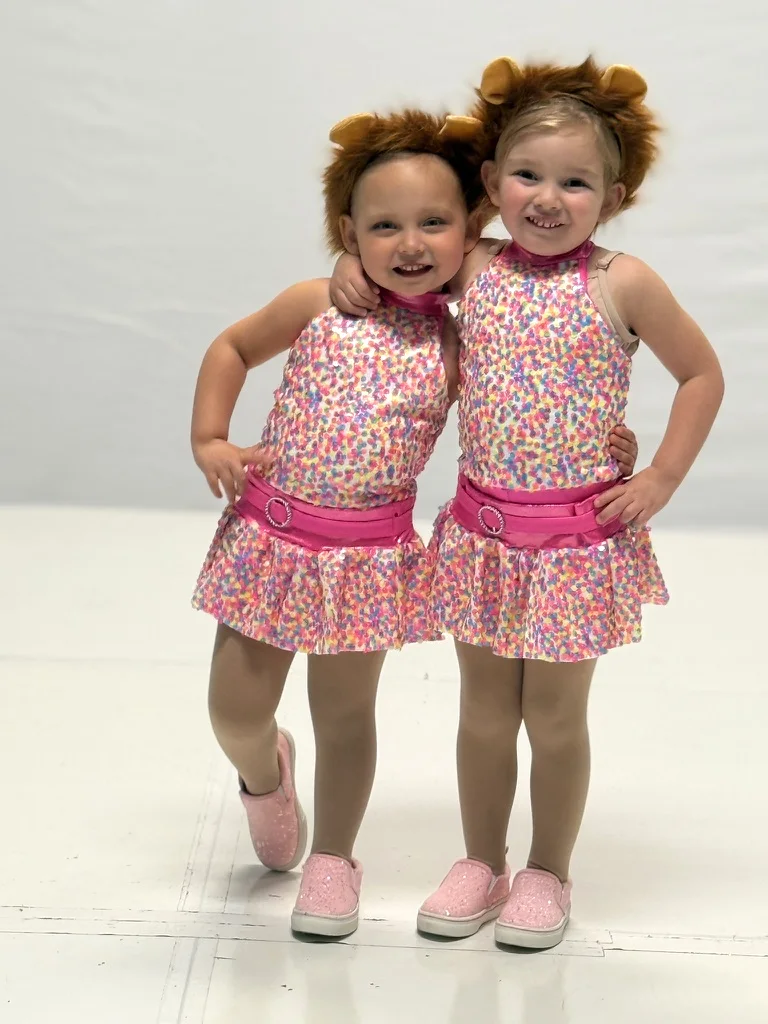 Two little dancers in lion costumes