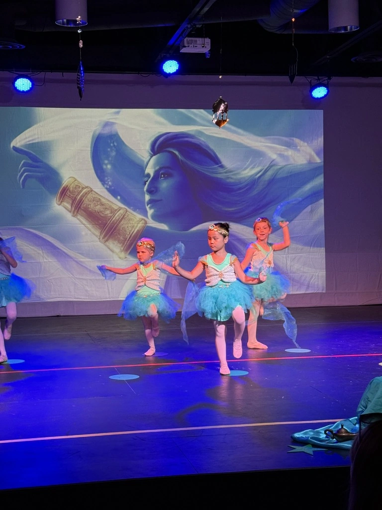 Little dancers in turquoise tutus performing Aladdin at Ovation Theatre